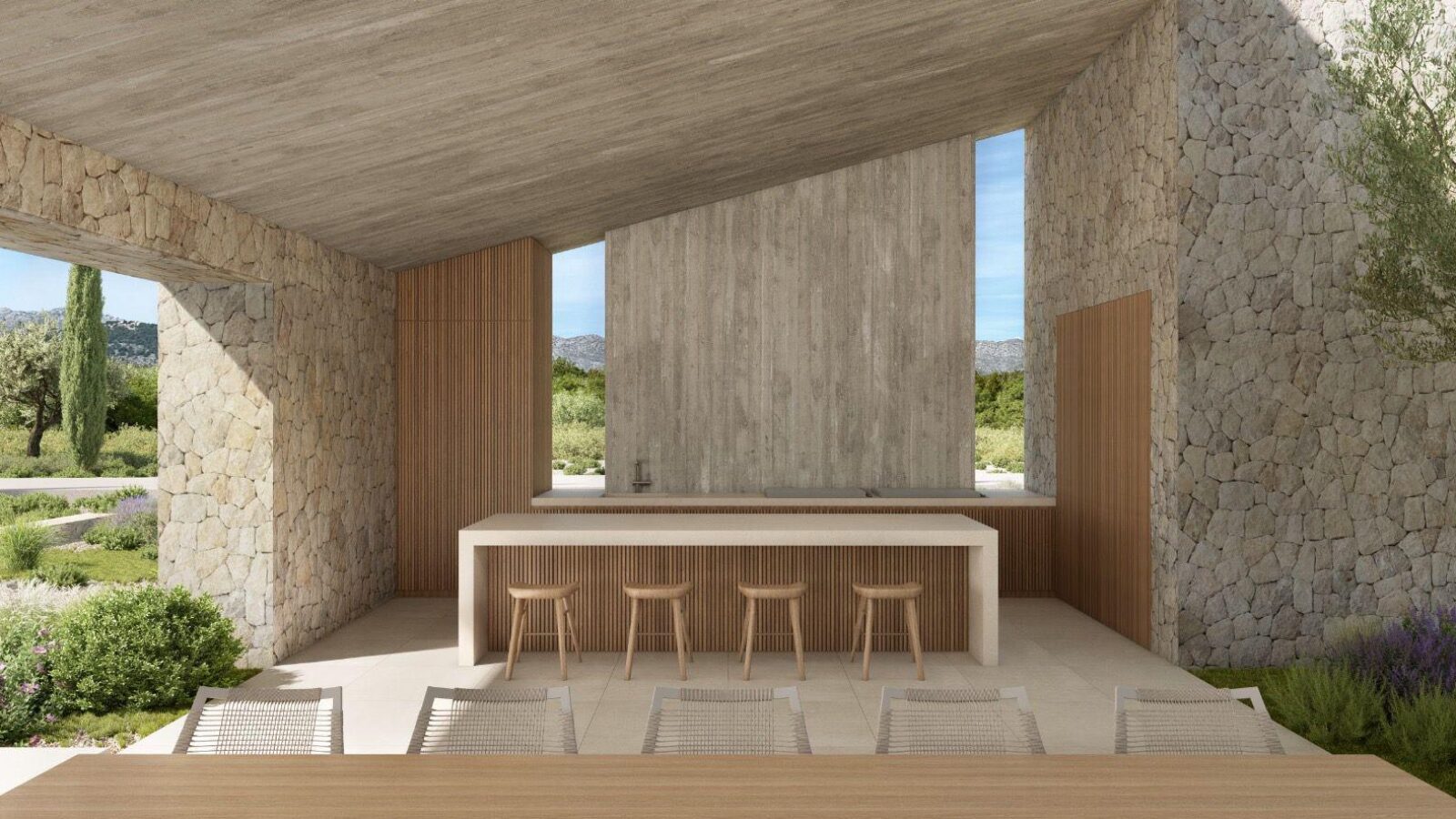 Outdoor kitchen and bar under a stone-walled porch