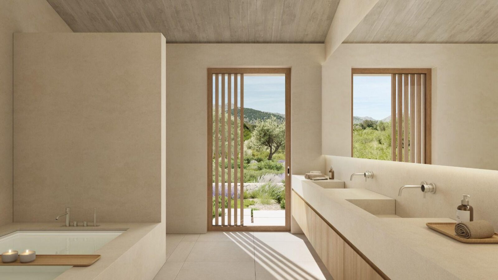 Baño con bañera, doble lavabo y vistas al jardín