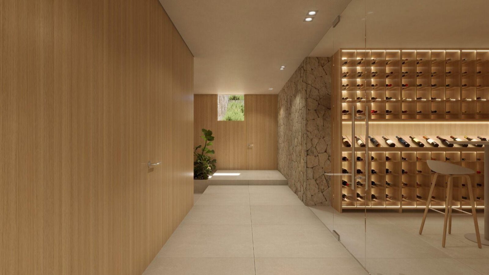 Bodega con pared de piedra y botelleros de madera