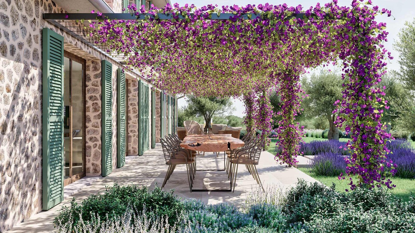 Outdoor dining table under a pergola with purple flowers beside the stone façade and green shutters