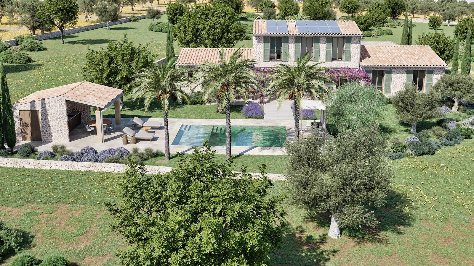 Aerial view of the pool with palm trees, a stone pool house with porch and the house behind